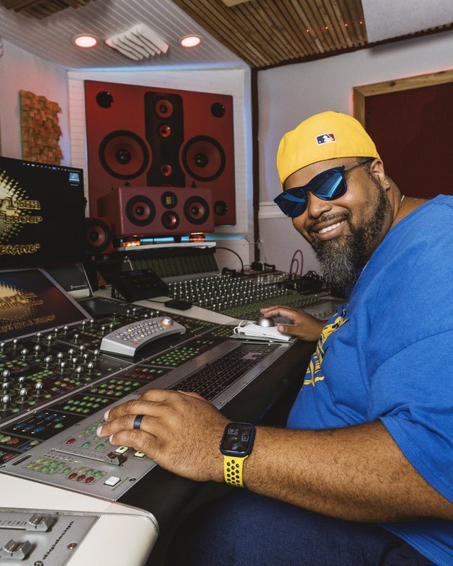 Artist in sunglasses at the console during the Seasons Shift event