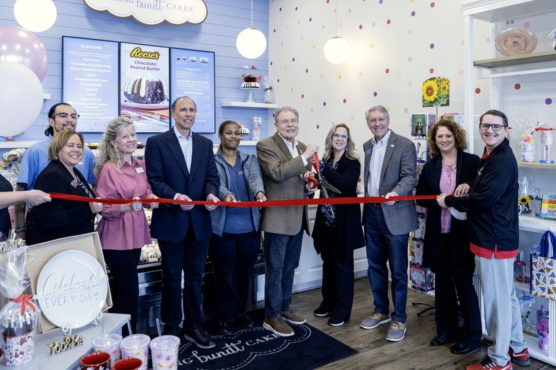 Ribbon-cutting line inside Nothing Bundt Cakes Peachtree Corners